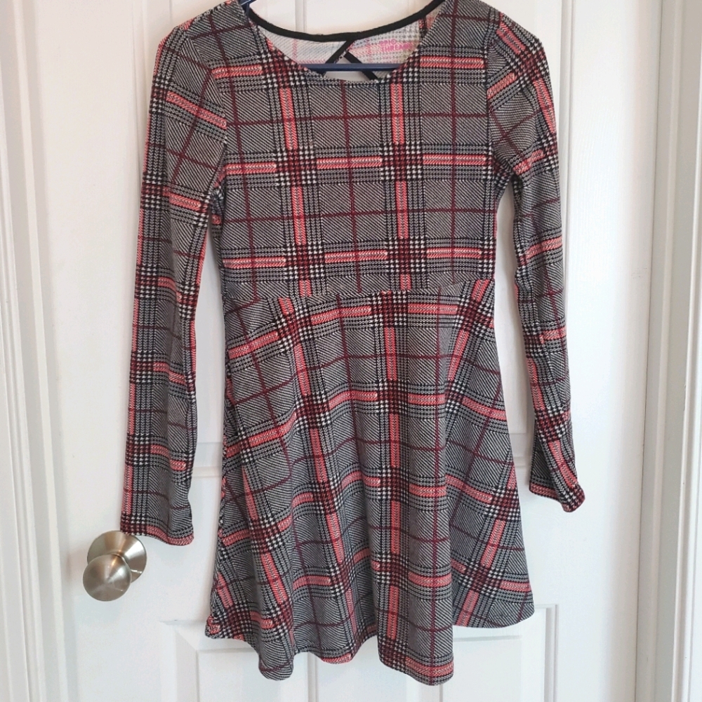 A long sleeved black and red plaid dress.
